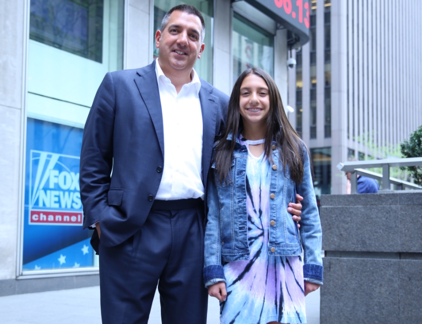 Paul Aversano outside of Fox News with his daughter